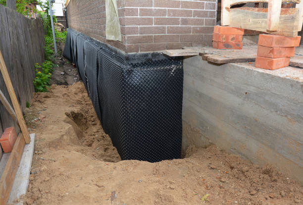 Happy homeowners after waterproofing job in Centerport
